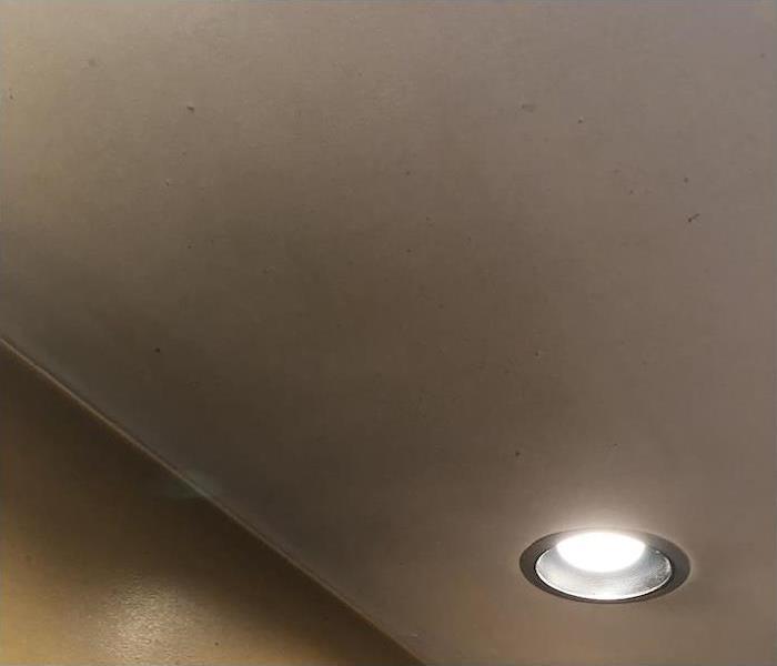 kitchen ceiling with smoke damage on a wall and ceiling